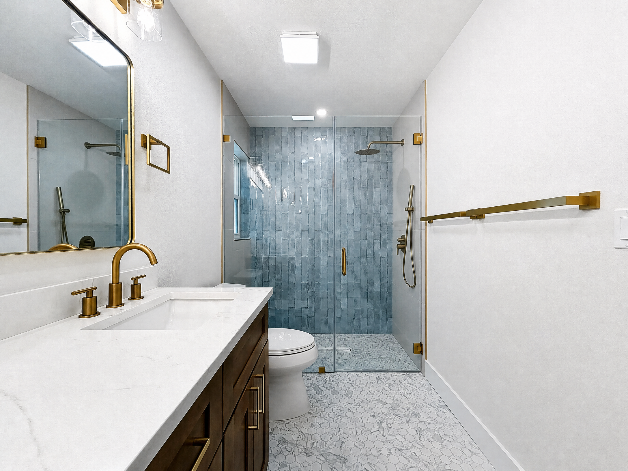 Tampa Bay bathroom remodeling project — Belleair walnut vanity and hex tile shower