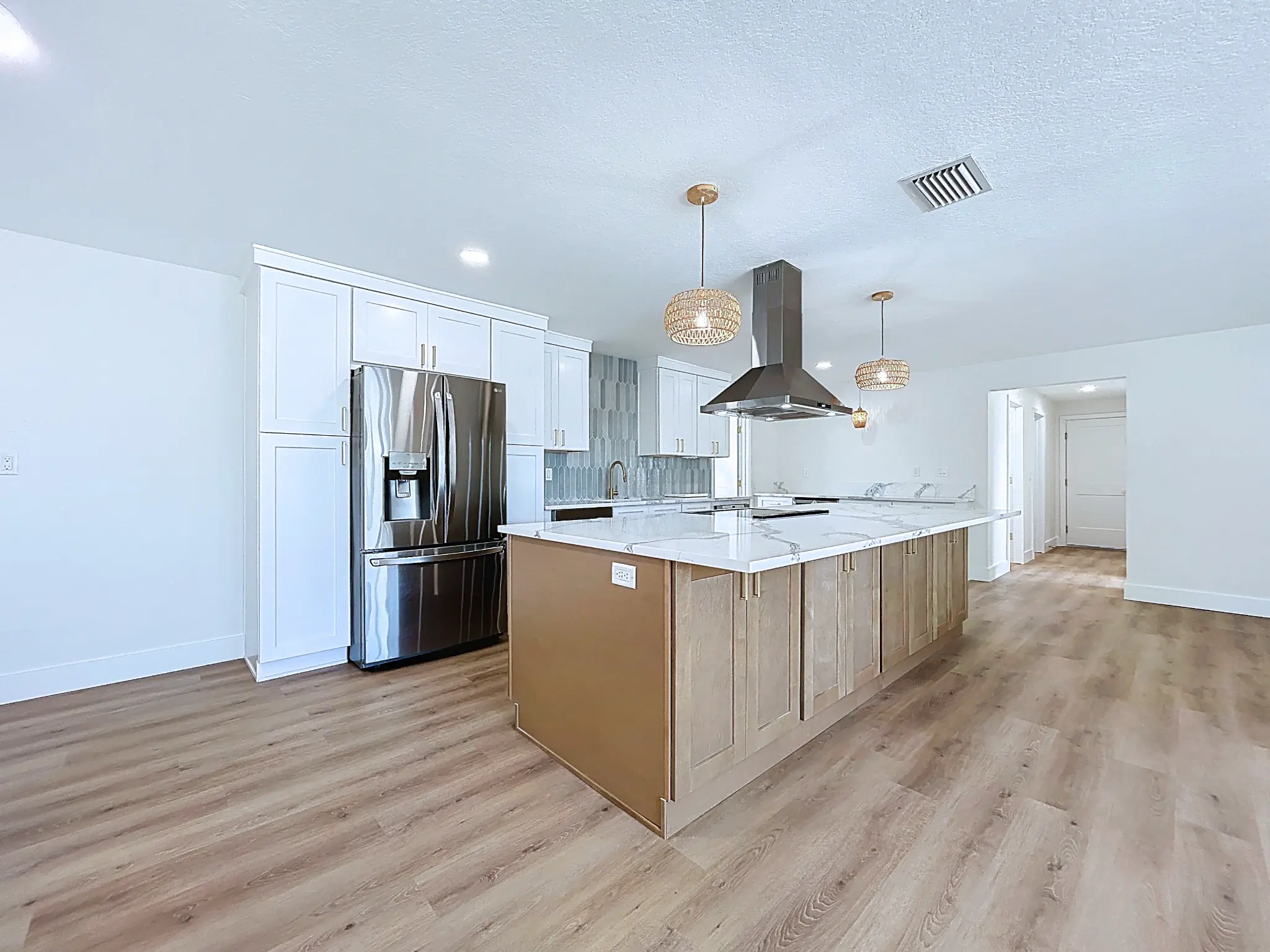 Tampa Bay kitchen remodeling — white and natural shaker kitchen with brass details