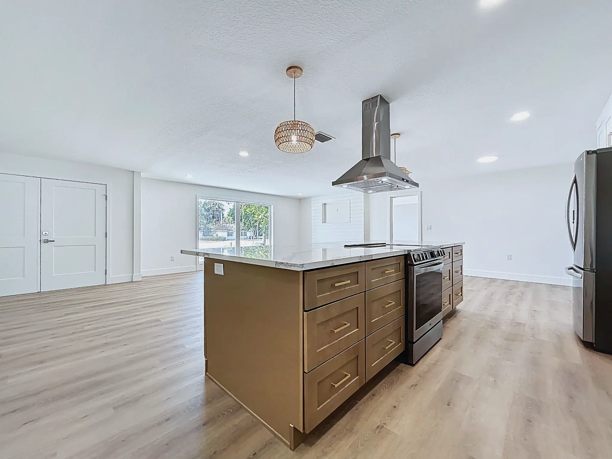Tampa Bay kitchen remodeling — white and natural shaker kitchen with brass details