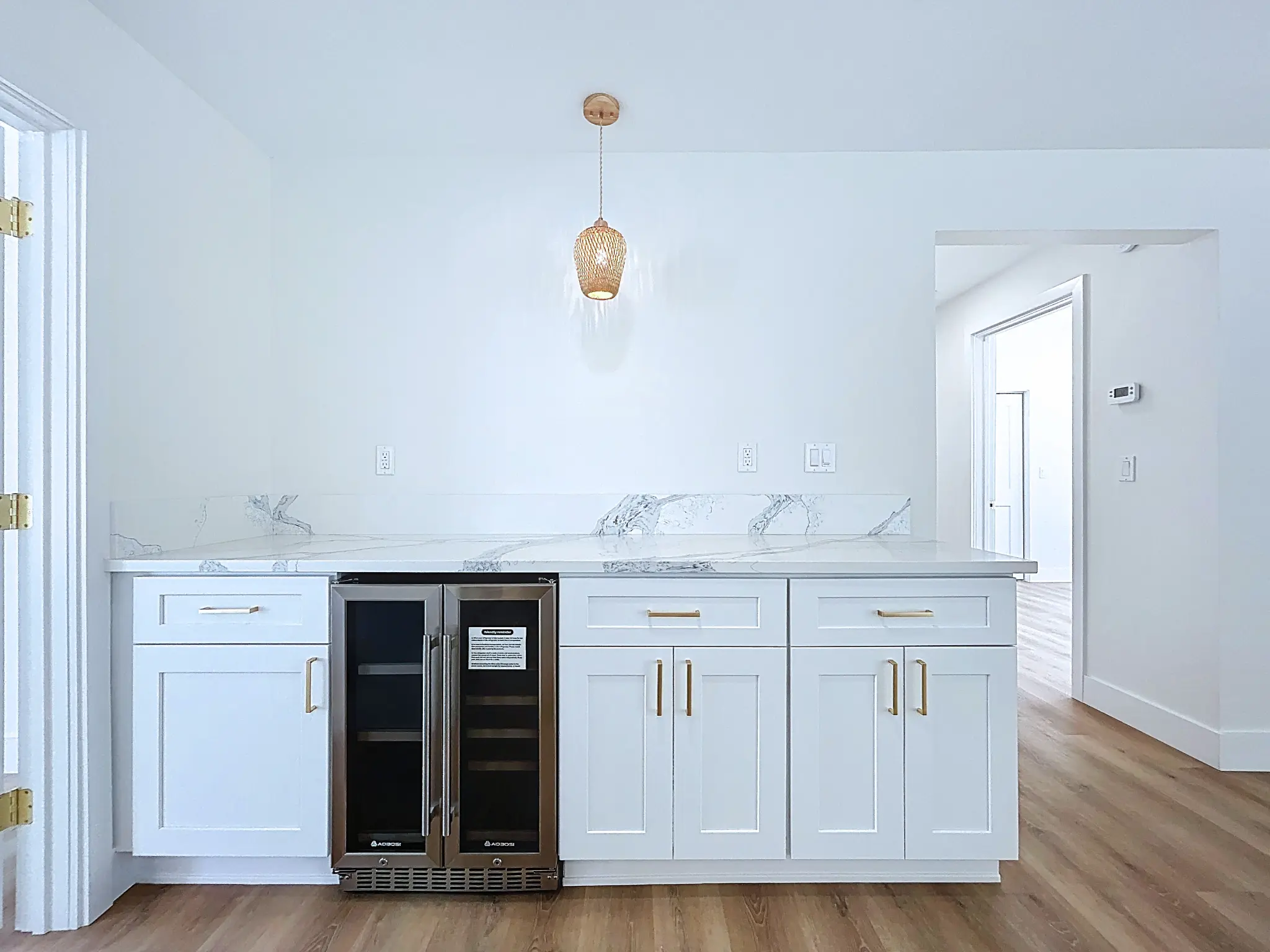 Tampa Bay kitchen remodeling — white and natural shaker kitchen with brass details