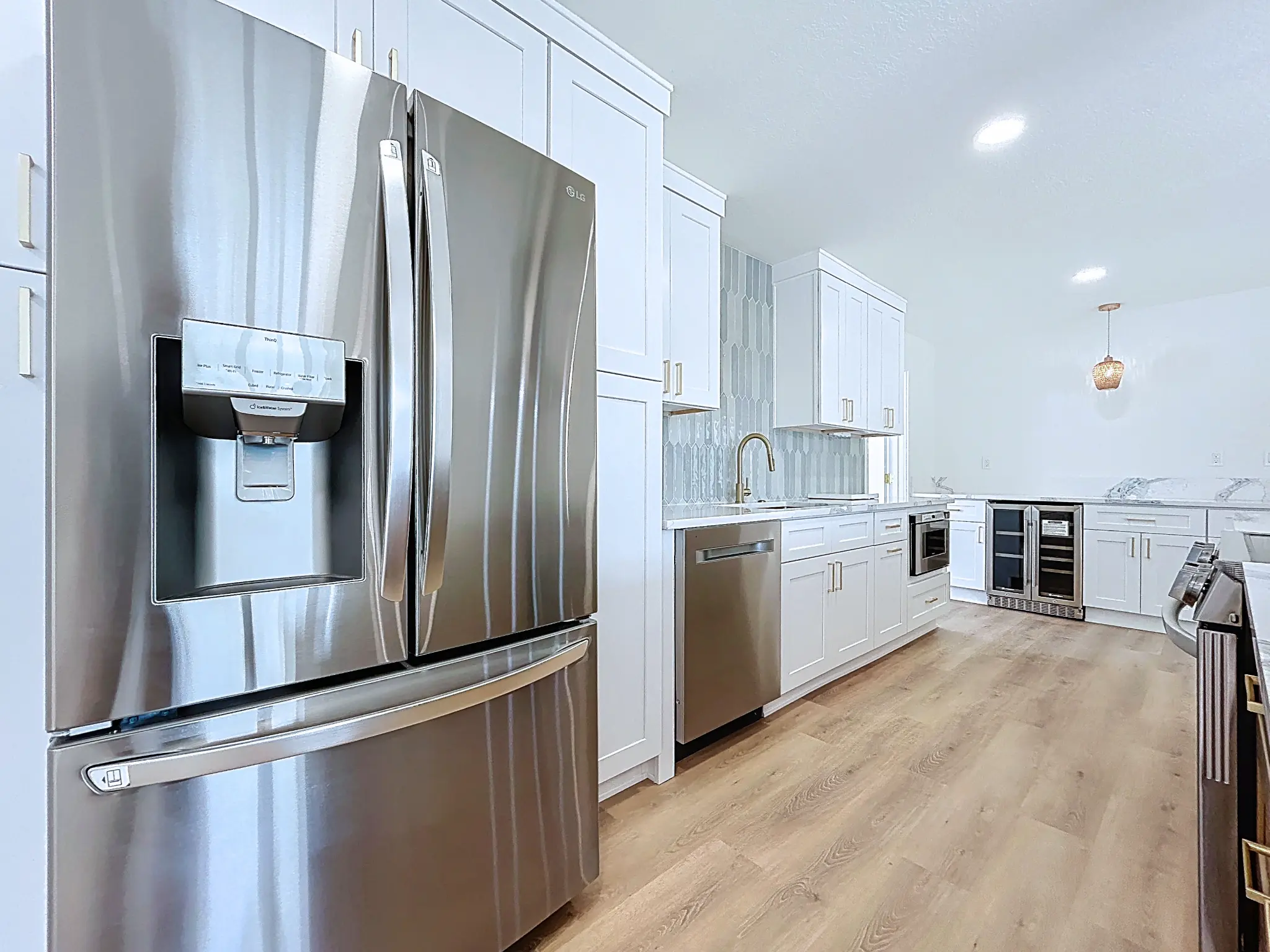 Tampa Bay kitchen remodeling — white and natural shaker kitchen with brass details