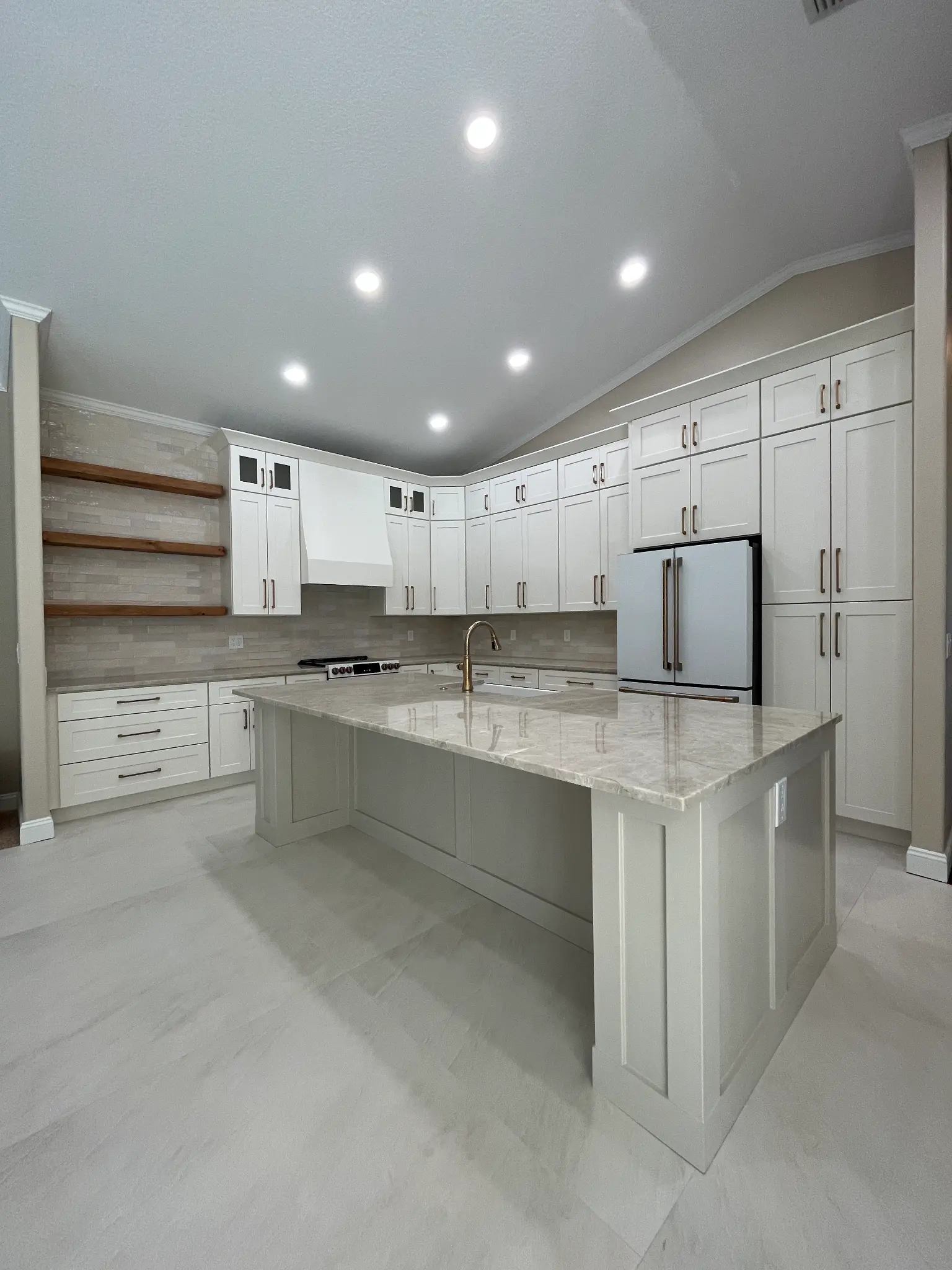 Tampa Bay kitchen remodeling — white shaker kitchen with gold finishes