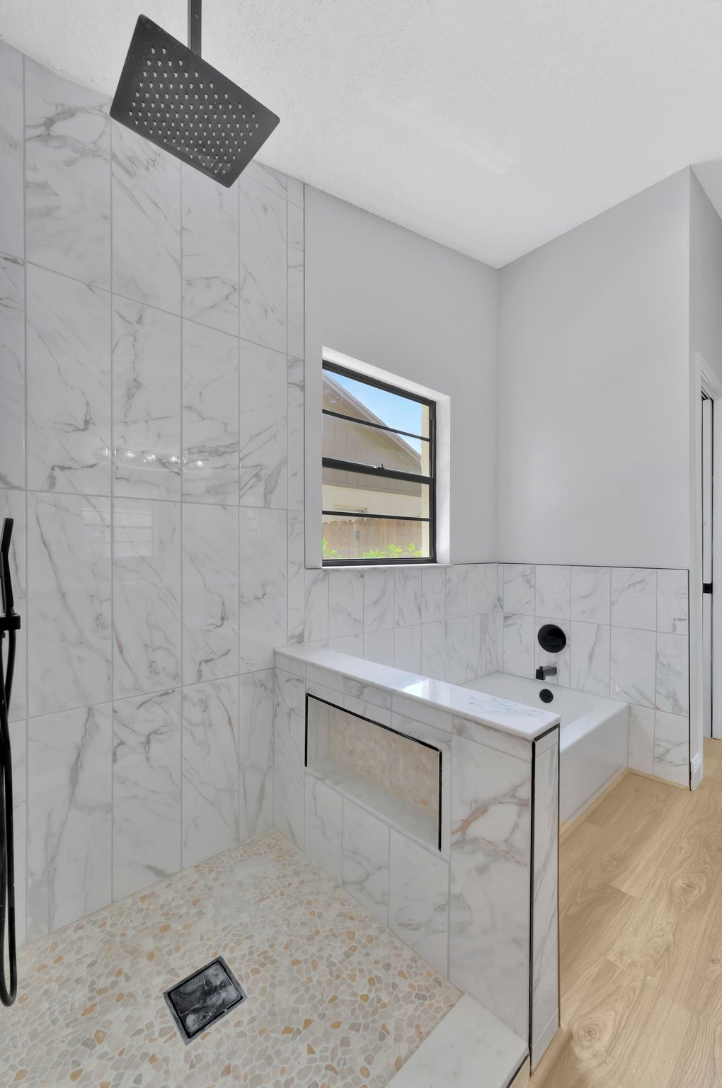 Tampa Bay bathroom remodeling — white bathroom renovation with black fixtures
