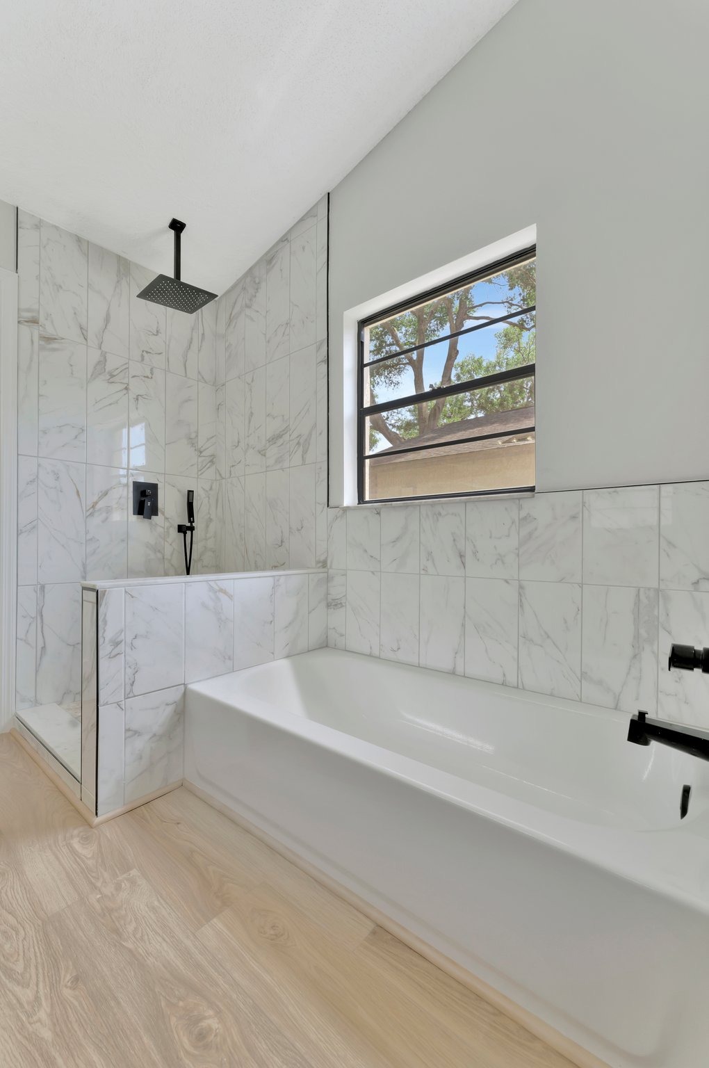 Tampa Bay bathroom remodeling — white bathroom renovation with black fixtures