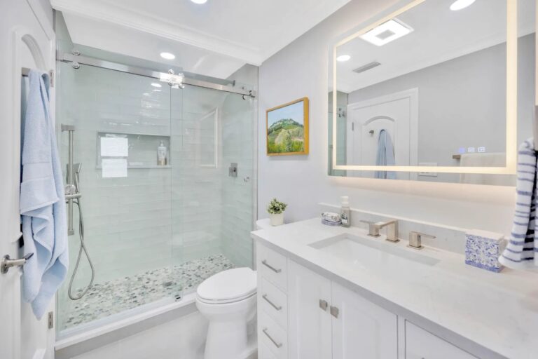 Tampa Bay bathroom remodeling — white shaker bathroom vanity and glass shower