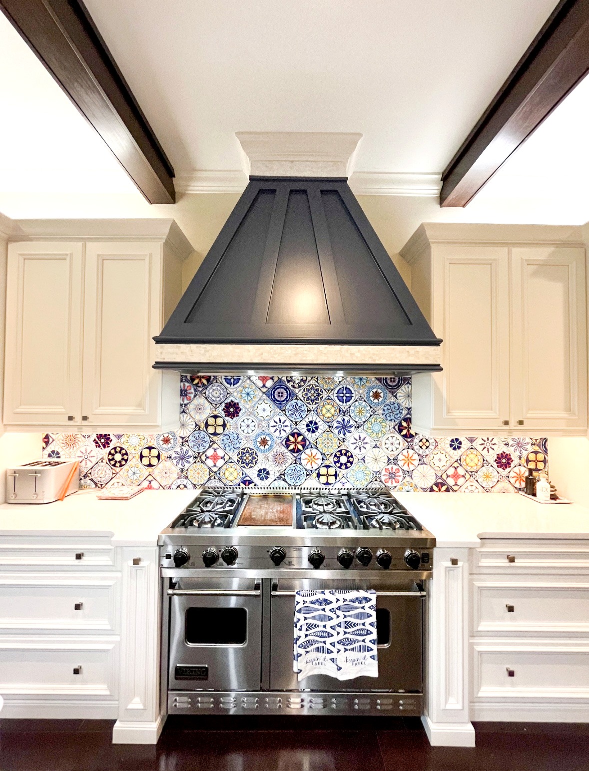 Cabinet refinishing project with Indigo Baltic hood and patterned tile backsplash — Bayshore Remodels Tampa Bay