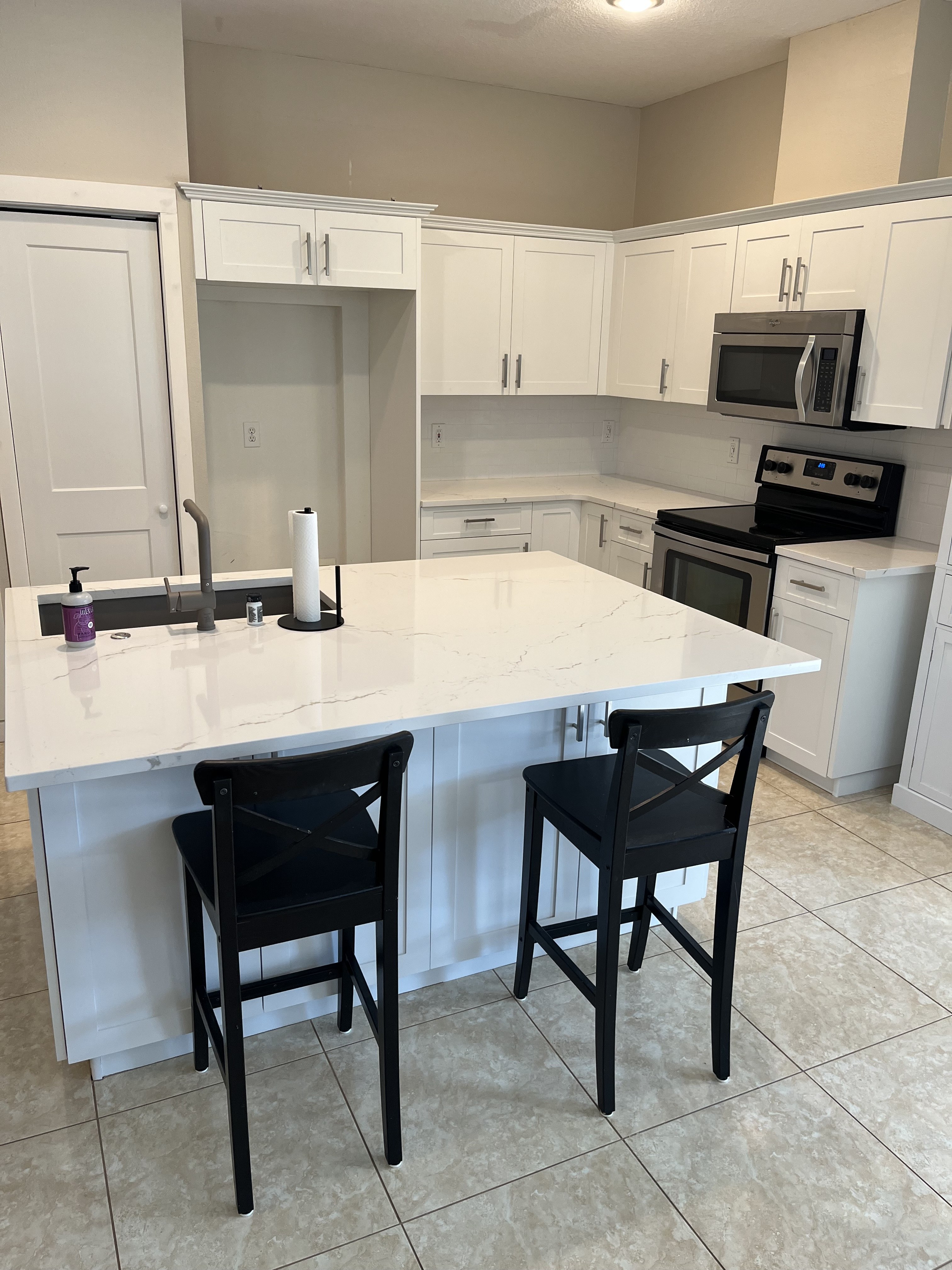 Pure white shaker cabinet refacing with quartz island &mdash; Tampa Bay