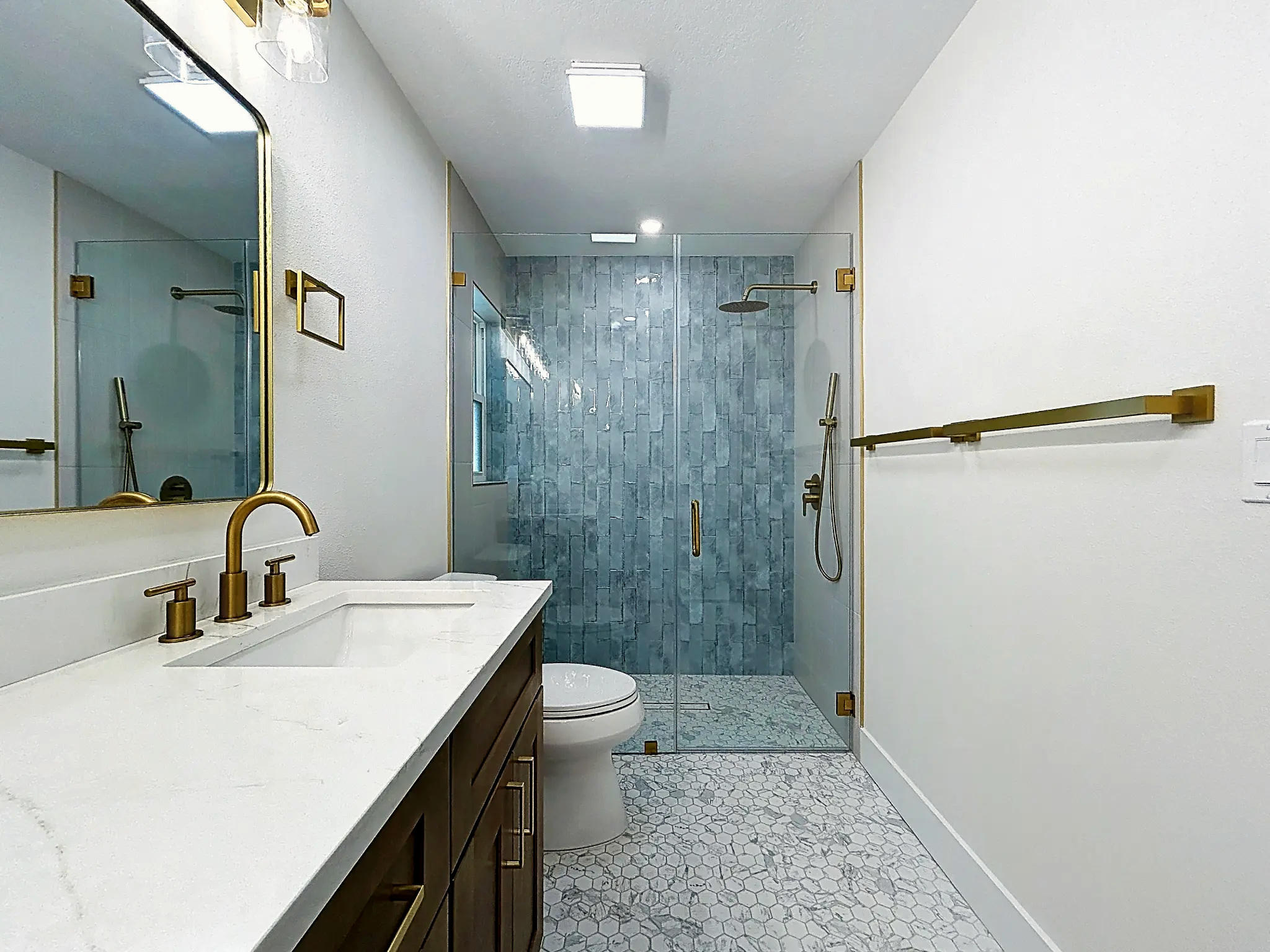 Bathroom remodeling in Tampa Bay — Belleair walnut vanity and hex tile shower
