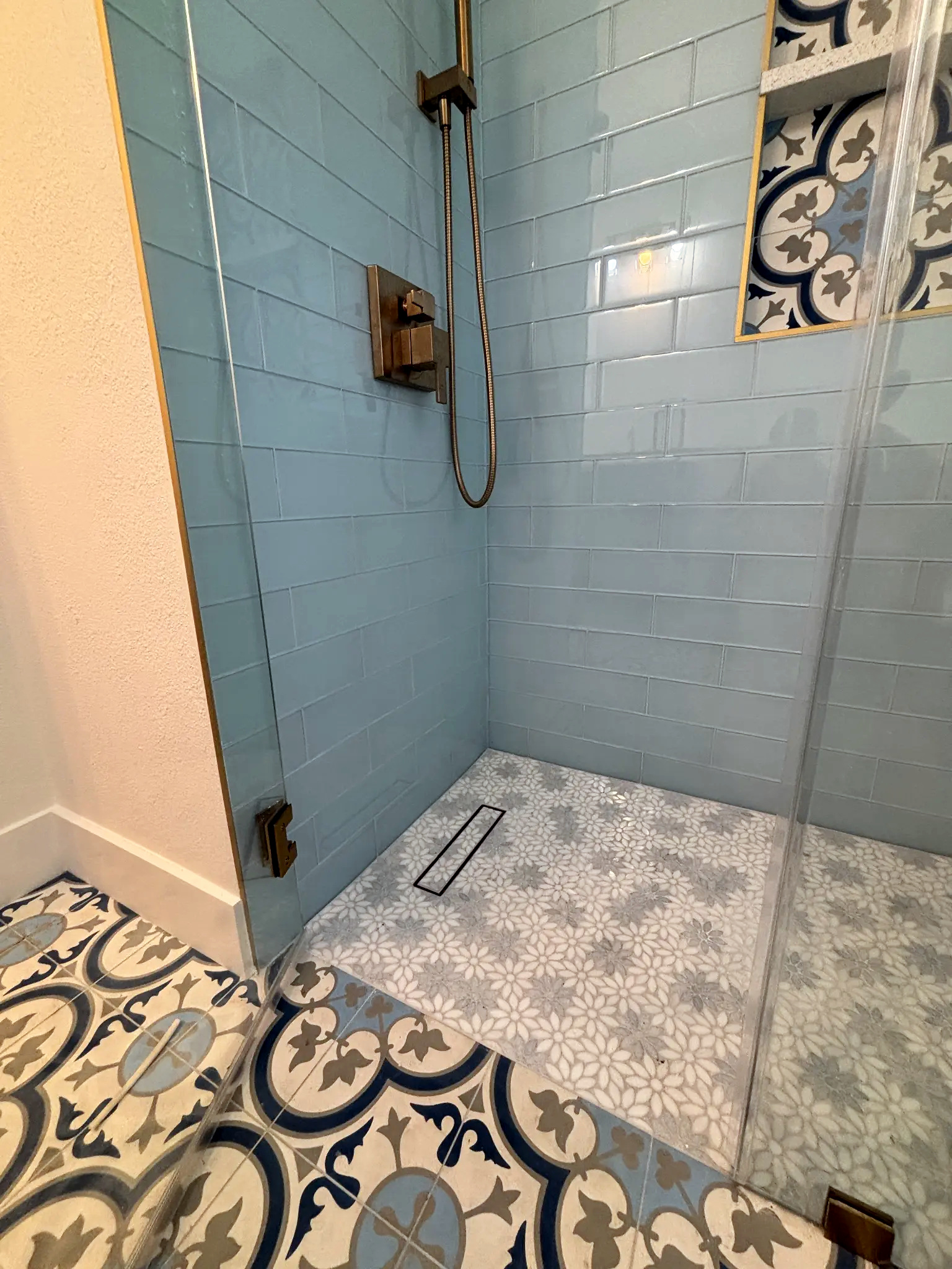 Bathroom remodeling in Tampa Bay — Blue floral tile shower detail
