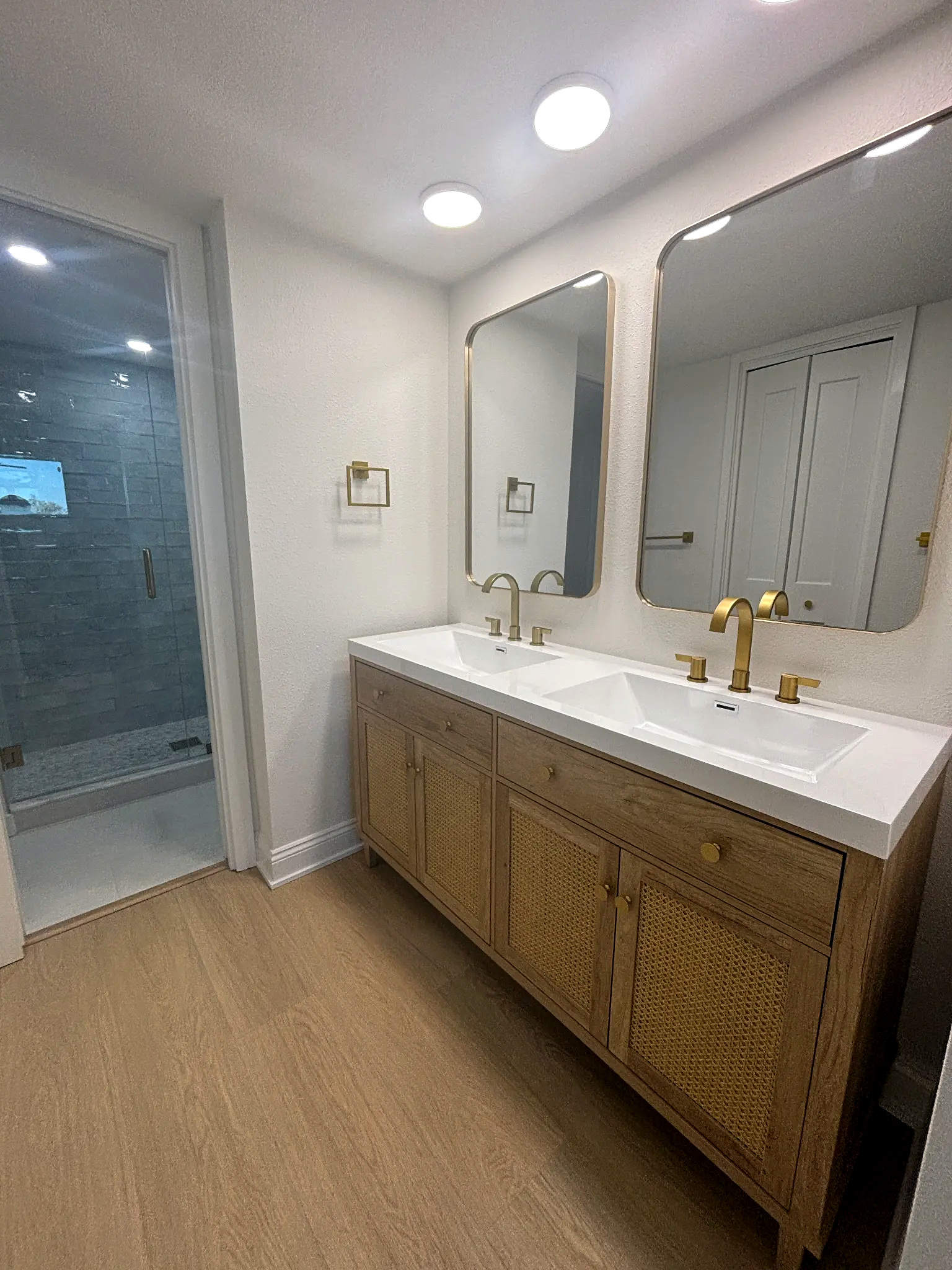 Bathroom remodeling in Tampa Bay — Bathroom double vanity with gold fixtures