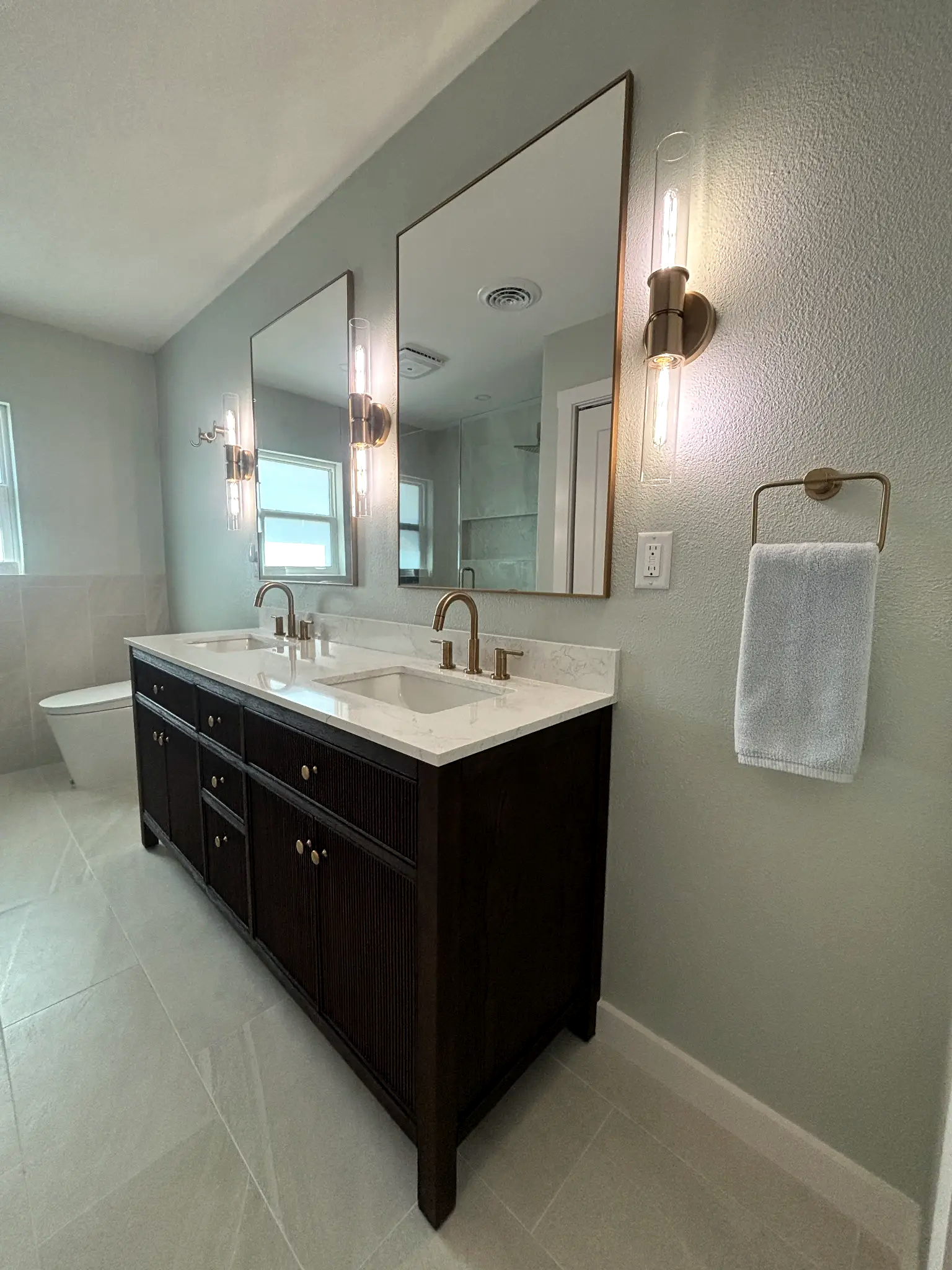 Bathroom remodeling in Tampa Bay — Grey chevron tile double vanity