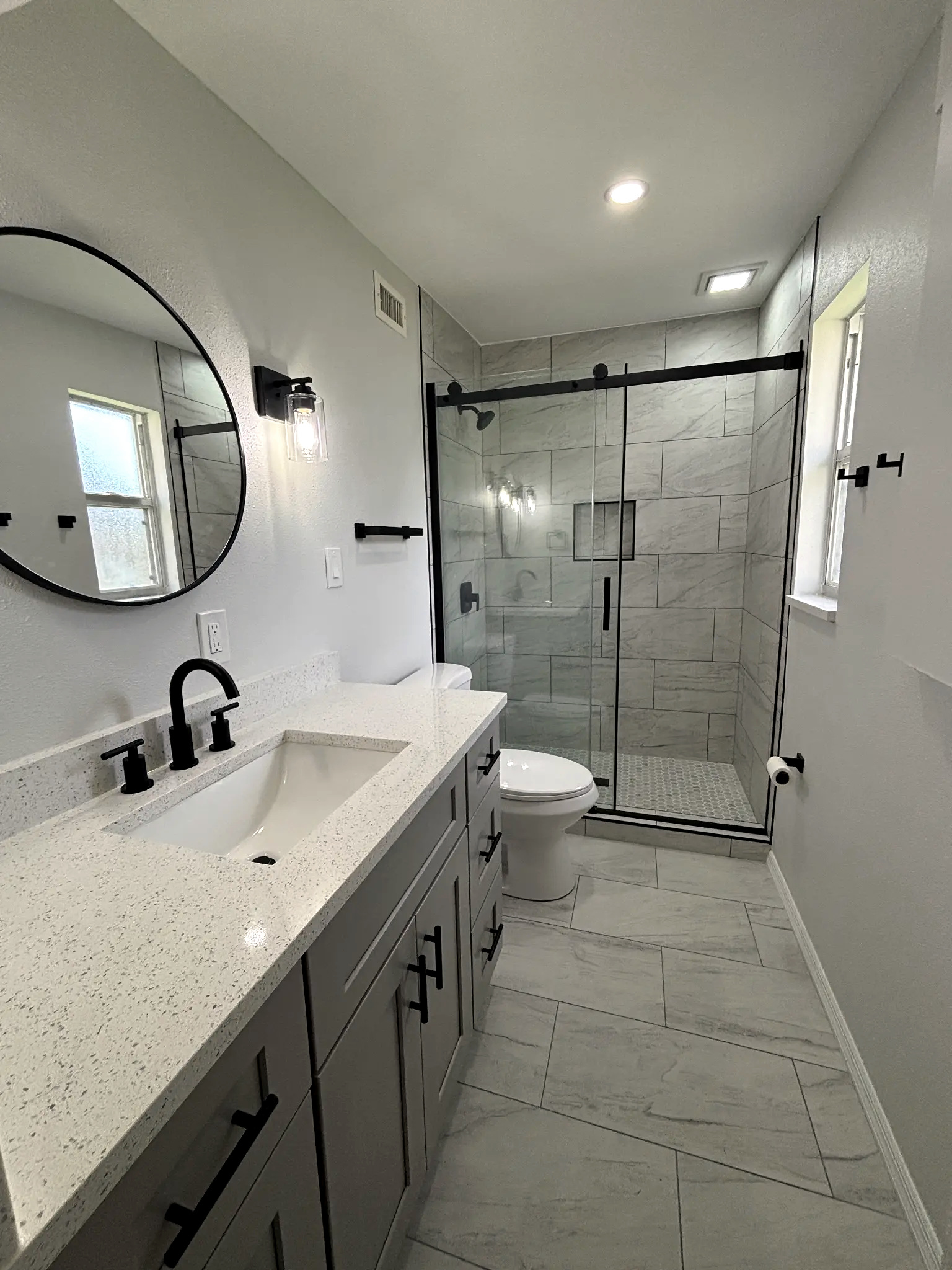 Bathroom remodeling in Tampa Bay — Modern grey tile bathroom vanity