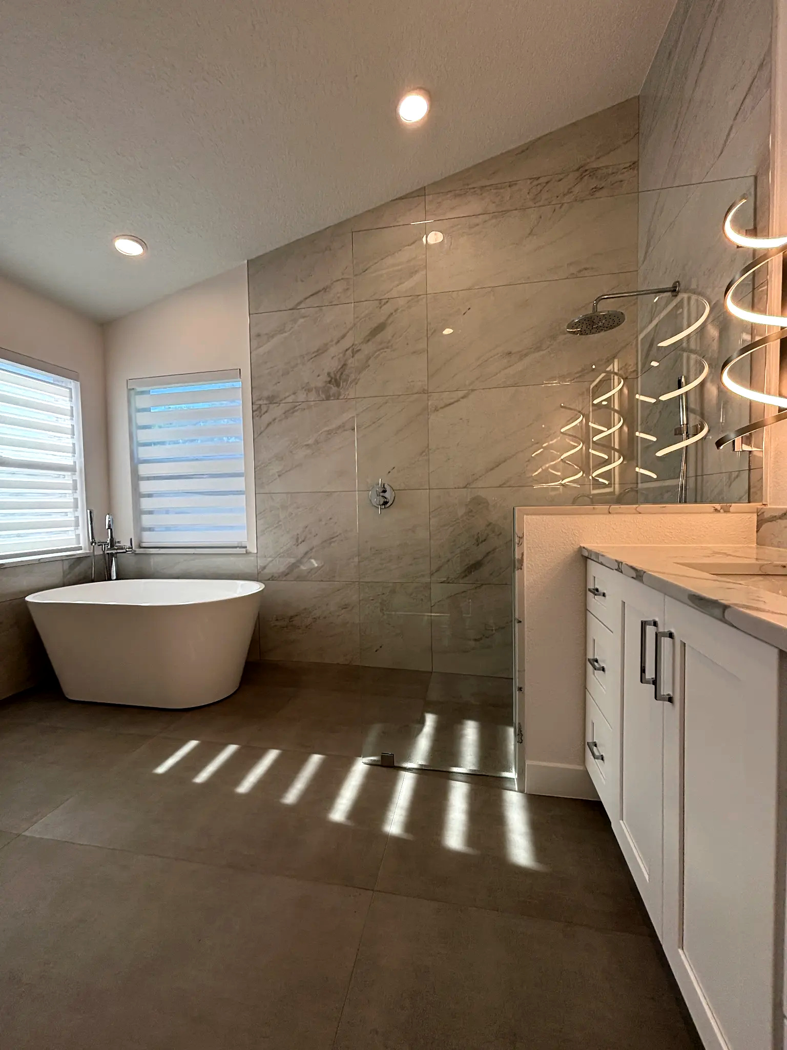 Bathroom remodeling in Tampa Bay — Grey wet room tub and vanity