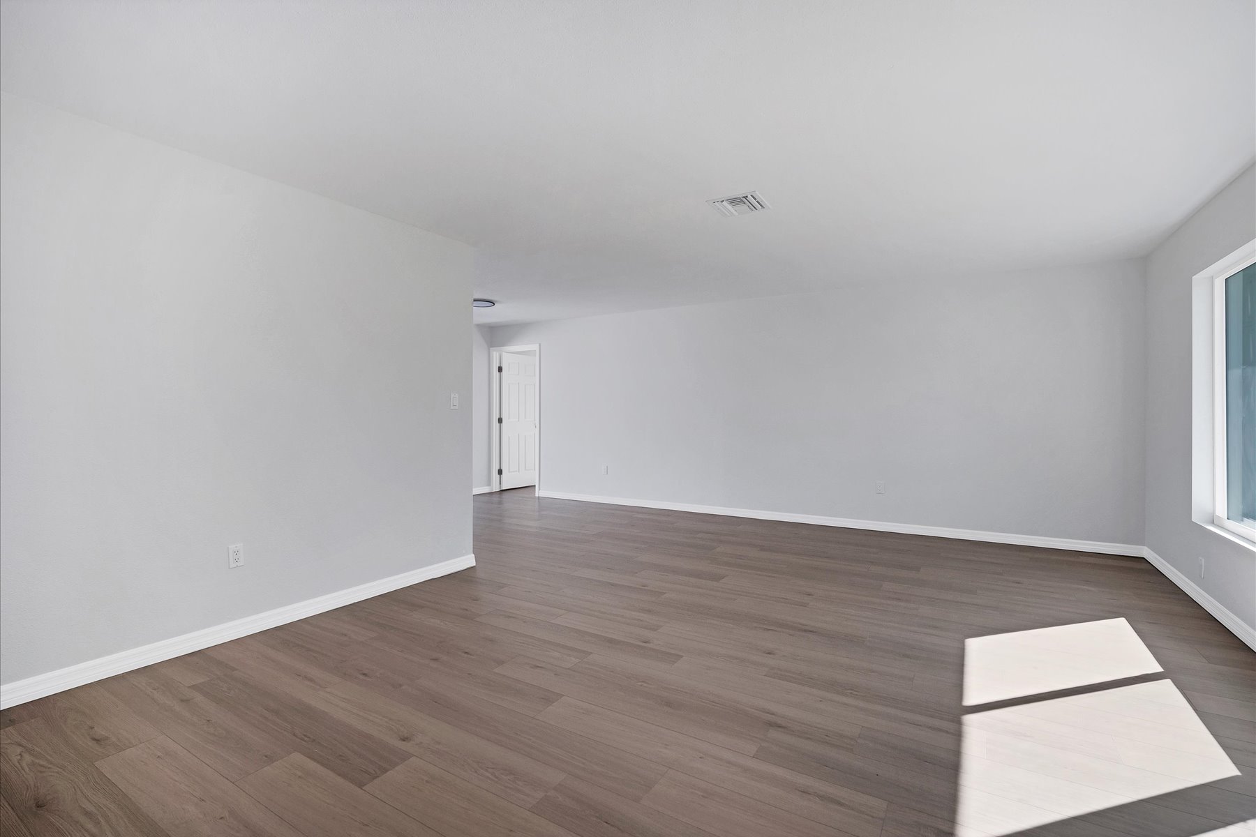 Dark LVP in open living area — Tampa Bay flooring
