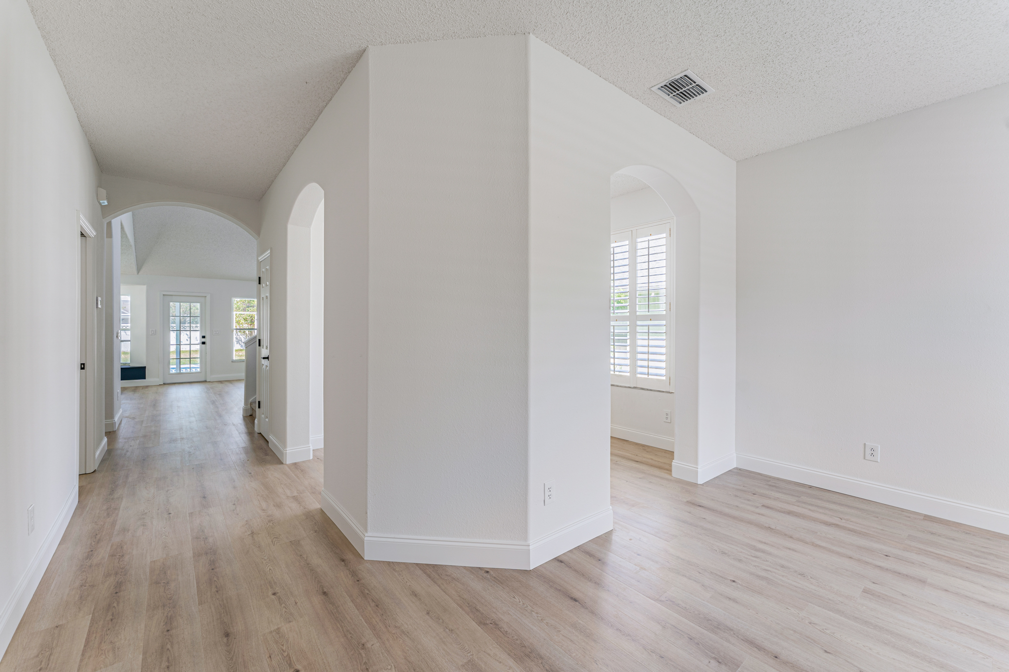 Light LVP with arched openings — Tampa Bay flooring