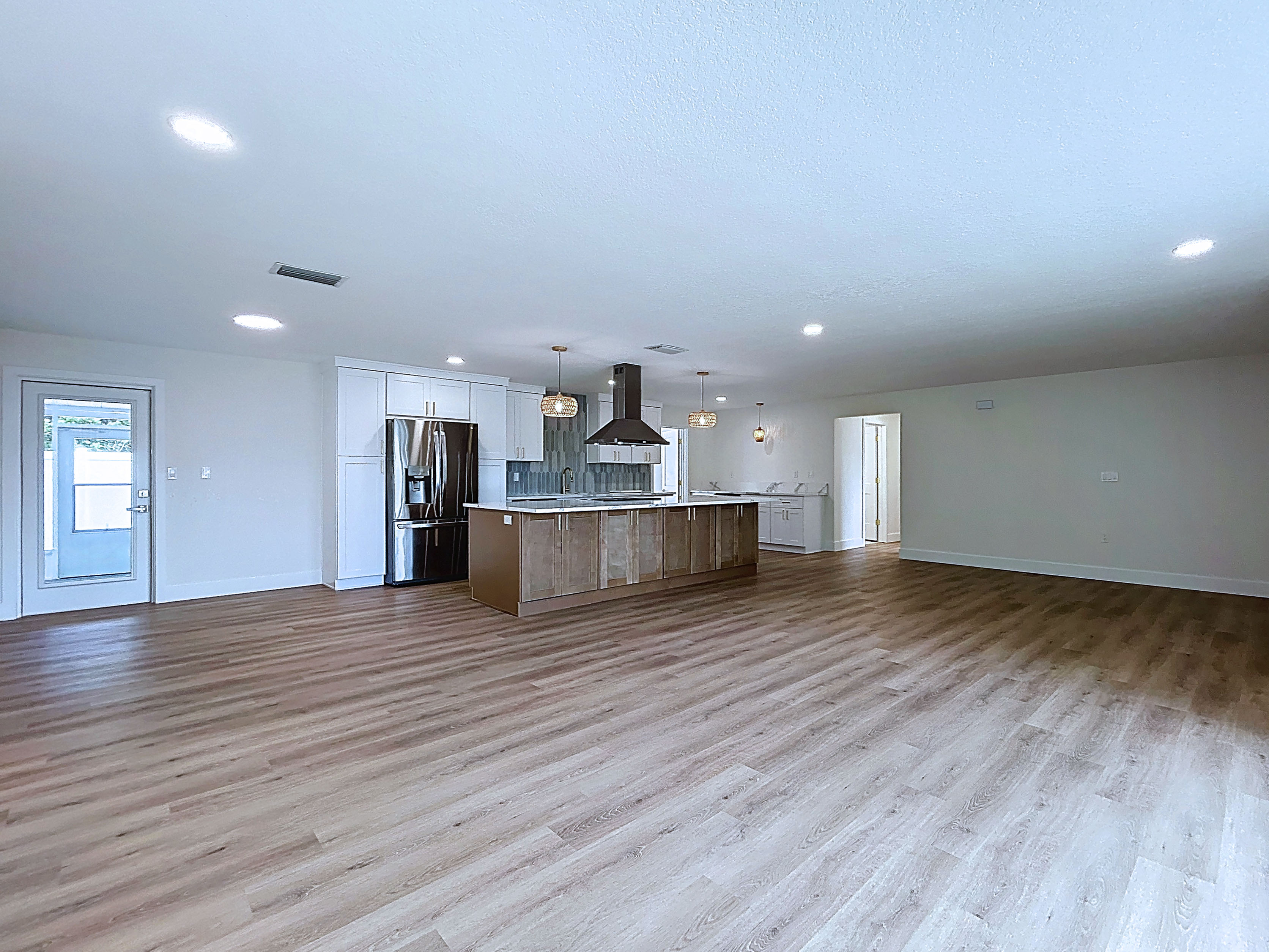 Basil oak LVP open plan throughout — Tampa Bay