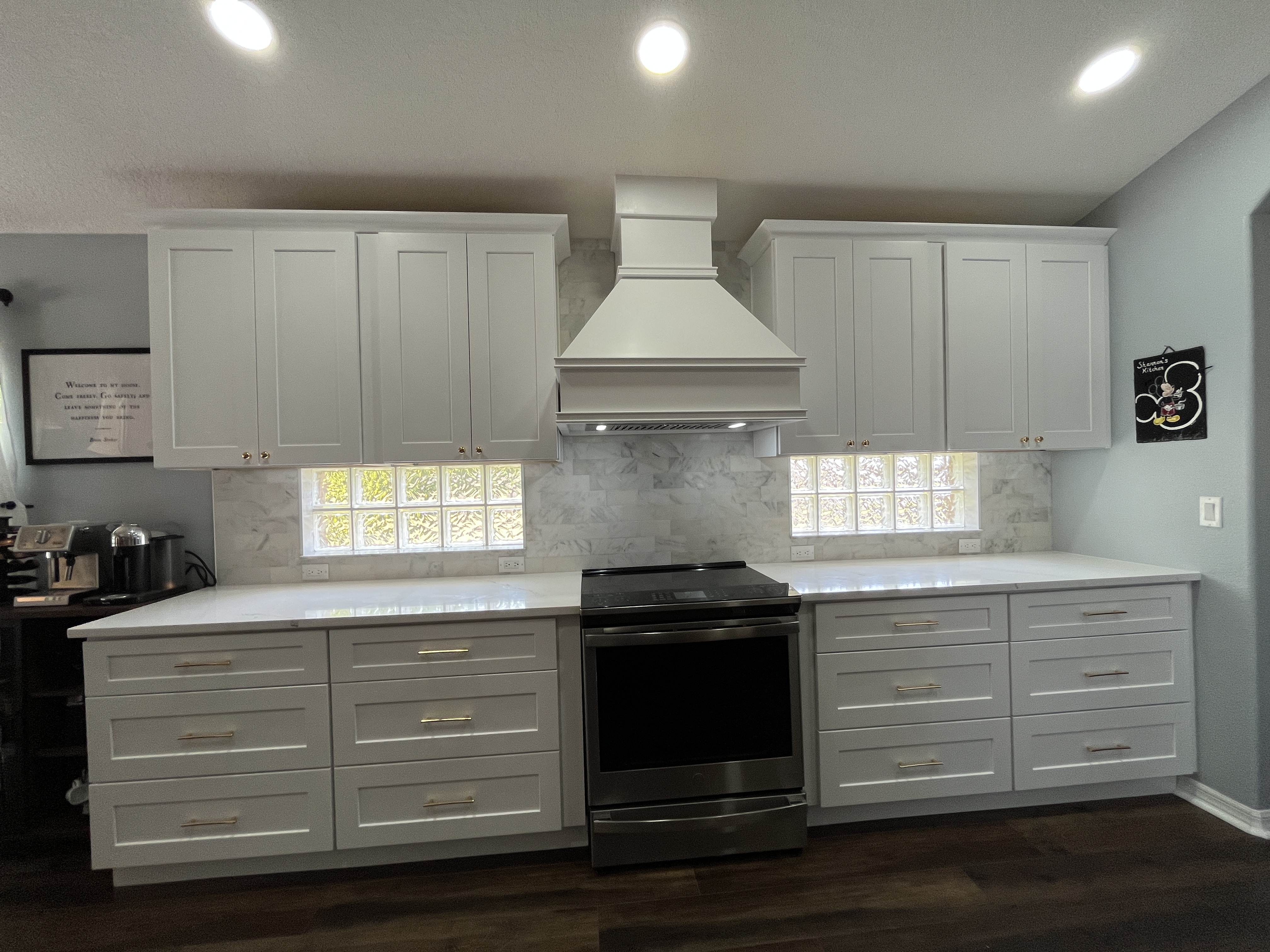 Custom plaster hood above range — coastal kitchen remodel Tampa Bay